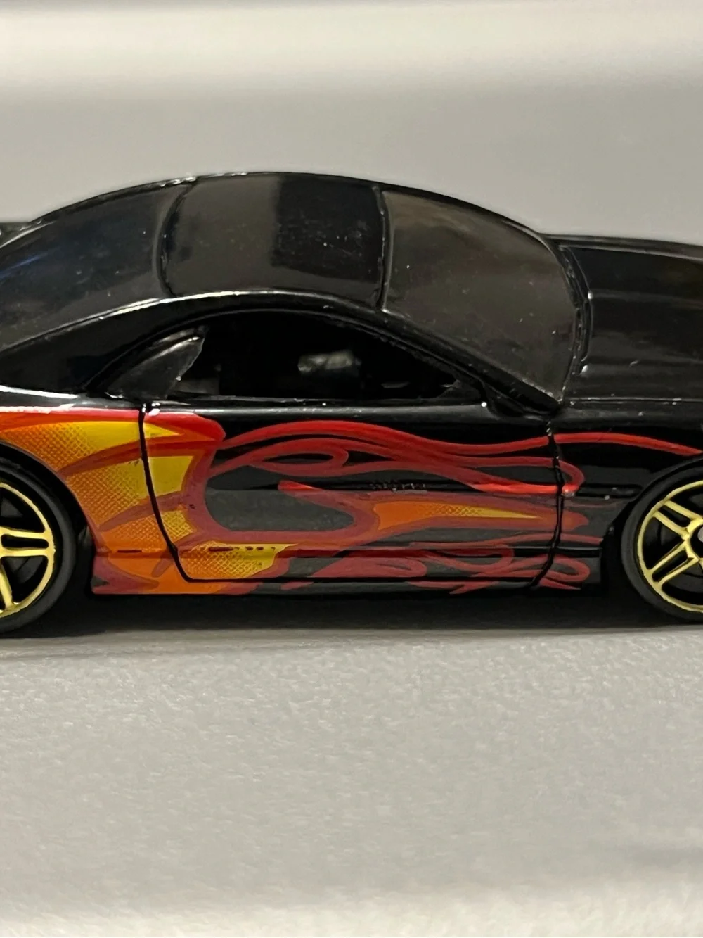 Hot Wheels Muscle Tone Car with Red and Orange Flame Graphics